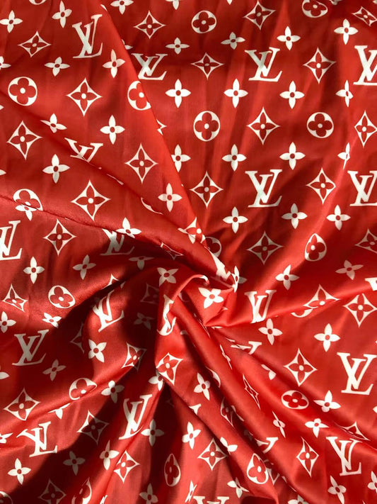 Tissu extensible LV en poly rouge vif lisse pour vêtements vendu au mètre