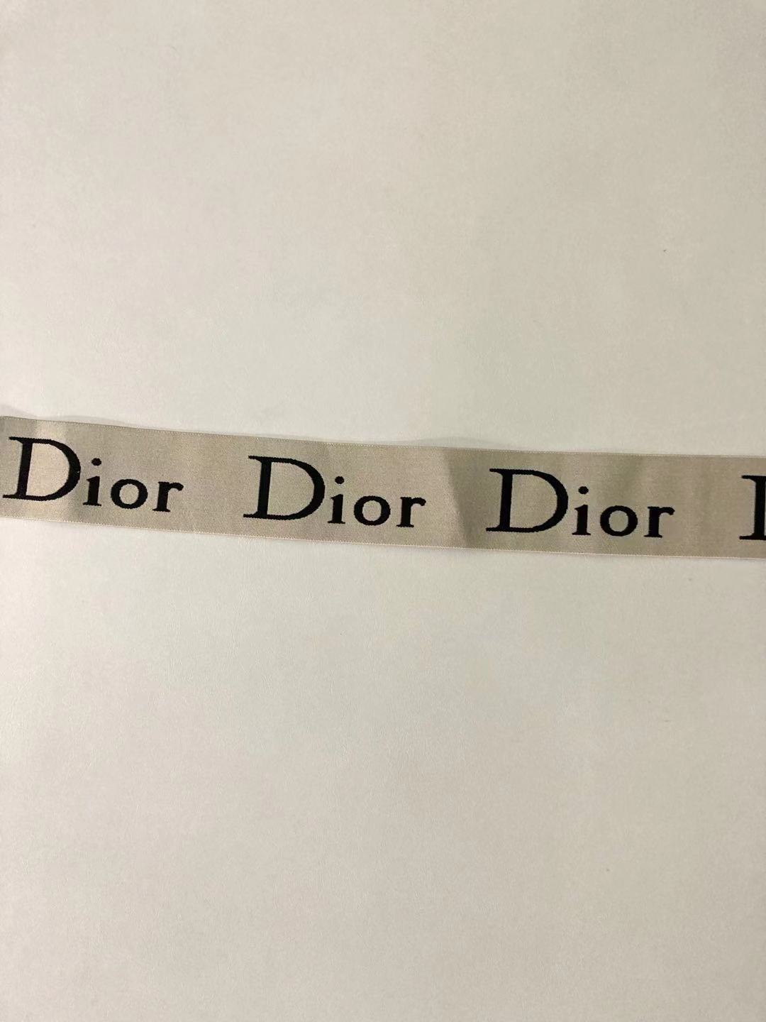 Cremefarbene elastische Träger mit Dior-Buchstaben